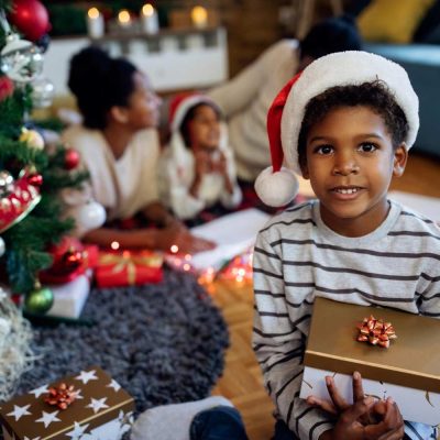 cute-black-boy-with-gift-box-christmas-day-home